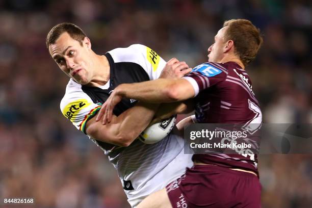 Isaah Yeo of the Panthers is tackled by Daly Cherry-Evans of the Sea Eagles during the NRL Elimination Final match between the Manly Sea Eagles and...