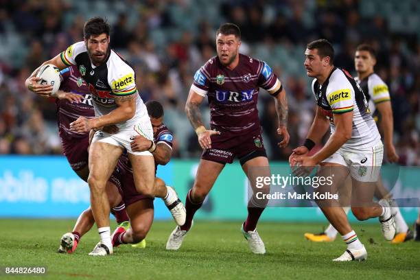 James Tamou of the Panthers passes to Reagan Campbell-Gillard of the Panthers as he is tackled during the NRL Elimination Final match between the...