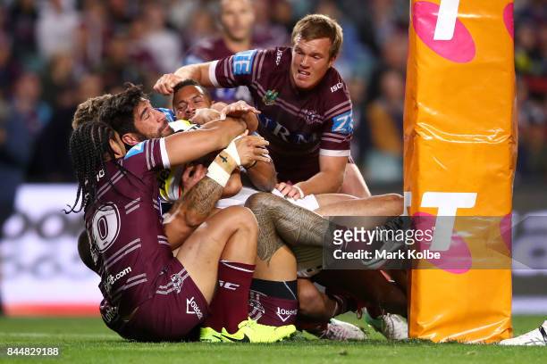 James Tamou of the Panthers is held up over the try line during the NRL Elimination Final match between the Manly Sea Eagles and the Penrith Panthers...
