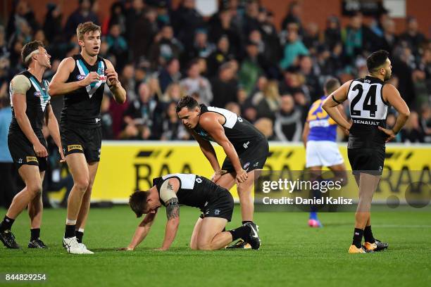 Power players look on dejected after the AFL First Elimination Final match between Port Adelaide Power and West Coast Eagles at Adelaide Oval on...
