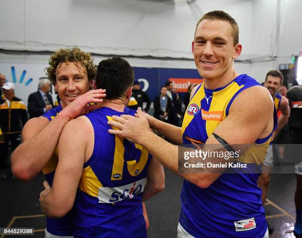 Matt Priddis, Luke Shuey and Drew Petrie of the Eagles celebrate after the AFL First Elimination Final match between Port Adelaide Power and West...
