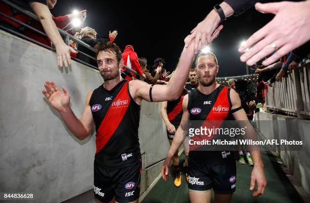 Retiring Bombers Jobe Watson and James Kelly leave the field during the AFL Second Elimination Final match between the Sydney Swans and the Essendon...