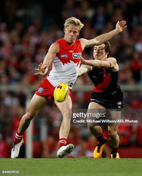 Isaac Heeney of the Swans and Andrew McGrath of the Bombers compete for the ball during the AFL Second Elimination Final match between the Sydney...
