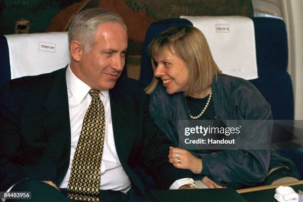 In this Israeli Government Press Office file photo, Prime Minister Benjamin Netanyahu and his wife Sara Netanyahu on board an Israeli Air Force jet,...