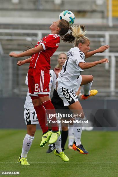 Melanie Leupolz of Bayern Muenchen and Julia Simic of SC Freiburg in action during the women Bundesliga match between Bayern Muenchen and SC Freiburg...