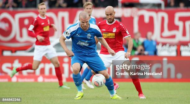 Daniel Brueckner of Erfurt challenges Manfred Starke of Jena during the 3.Liga match between FC Rot Weiss Erfurt and FC Carl Zeiss Jena at...