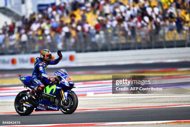 Movistar Yamaha Moto GP's spanish rider Maverick Vinales waves to the public after grabbing pole position for the San Marino Moto GP Grand Prix race...