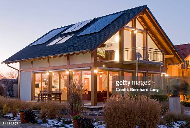 house with solar cells - pannello solare foto e immagini stock