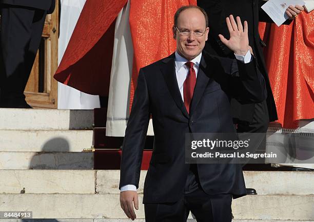 Prince Albert II of Monaco waves as he leaves the cathedral after Mass as part as the Sainte Devote ceremonies on January 27, 2009 in Monaco.