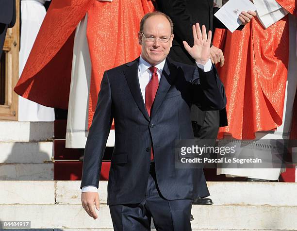 Prince Albert II of Monaco waves as he leaves the cathedral after Mass as part as the Sainte Devote ceremonies on January 27, 2009 in Monaco.