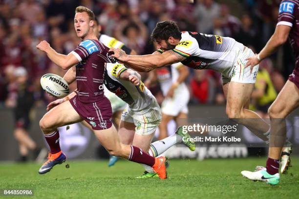 Daly Cherry-Evans of the Sea Eagles is tackled by James Tamou of the Panthers during the NRL Elimination Final match between the Manly Sea Eagles and...