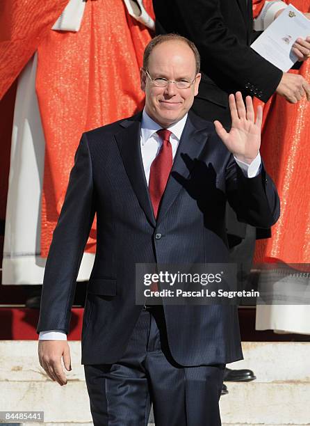 Prince Albert II of Monaco waves as he leaves the cathedral after a mass as part as the Sainte Devote ceremonies on January 27, 2009 in Monaco.