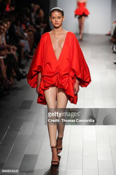 Model walks the runway wearing project runway design at Gallery 1, Skylight Clarkson Sq on September 8, 2017 in New York City.