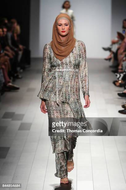 Model walks the runway wearing project runway design at Gallery 1, Skylight Clarkson Sq on September 8, 2017 in New York City.