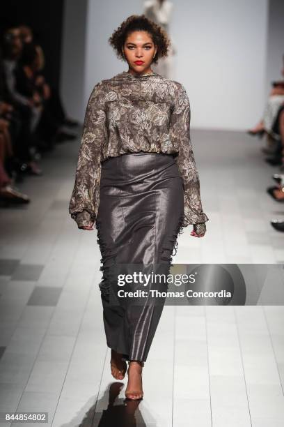 Model walks the runway wearing project runway design at Gallery 1, Skylight Clarkson Sq on September 8, 2017 in New York City.