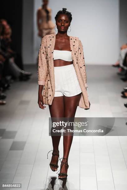 Model walks the runway wearing project runway design at Gallery 1, Skylight Clarkson Sq on September 8, 2017 in New York City.