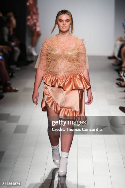 Model walks the runway wearing project runway design at Gallery 1, Skylight Clarkson Sq on September 8, 2017 in New York City.