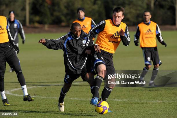 John Terry and Mineiro of Chelsea in action during a training session at the Chelsea FC training ground on January 27, 2009 in Cobham, United Kingdom