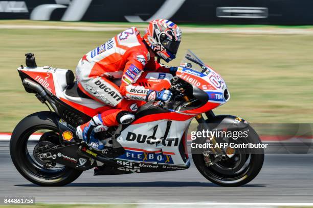 Ducati Team's rider Italian Andrea Dovizioso rides his bike during a qualifying session for the San Marino Moto GP Grand Prix race at the Marco...