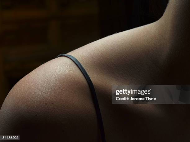 close up of a woman's shoulder and lingerie strap - woman in spaghetti straps stock pictures, royalty-free photos & images