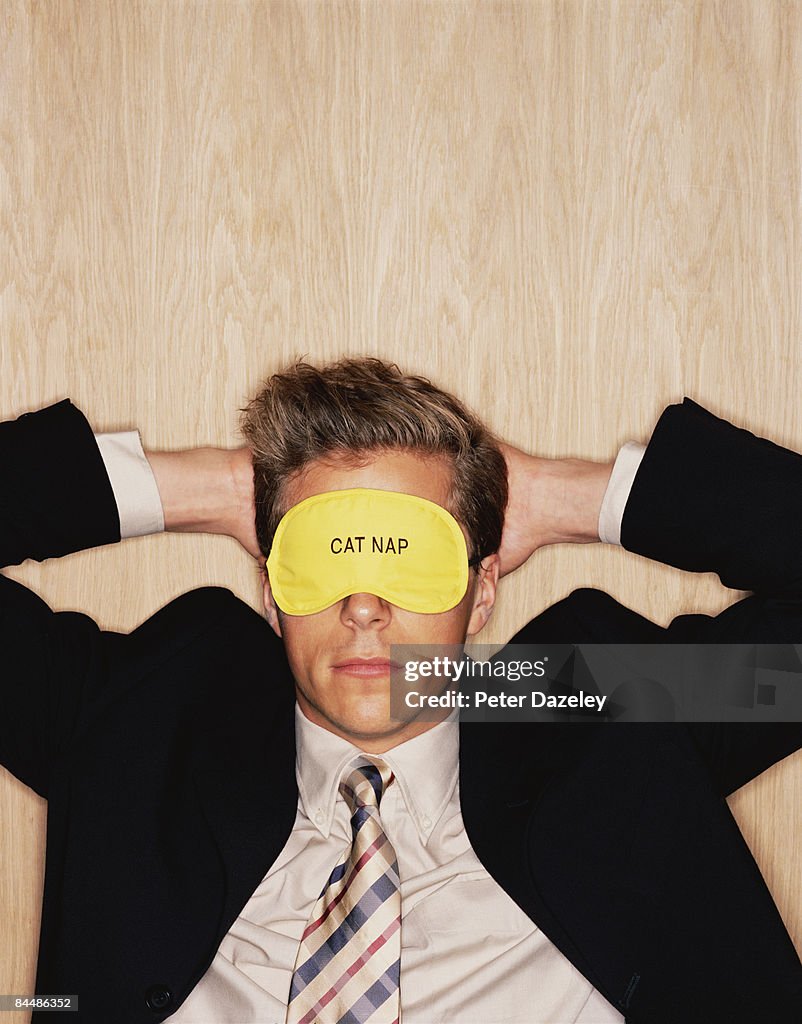 Businessman having cat nap