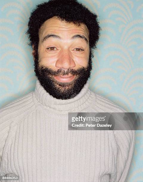 bearded african man in polo neck - polo neck stock-fotos und bilder