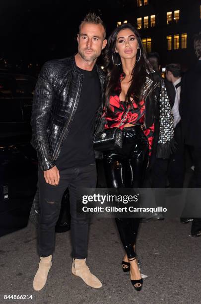 Fashion designer Philipp Plein and Andreea Sasu are seen arriving the Harper's BAZAAR Celebration of 'ICONS By Carine Roitfeld' at The Plaza Hotel...