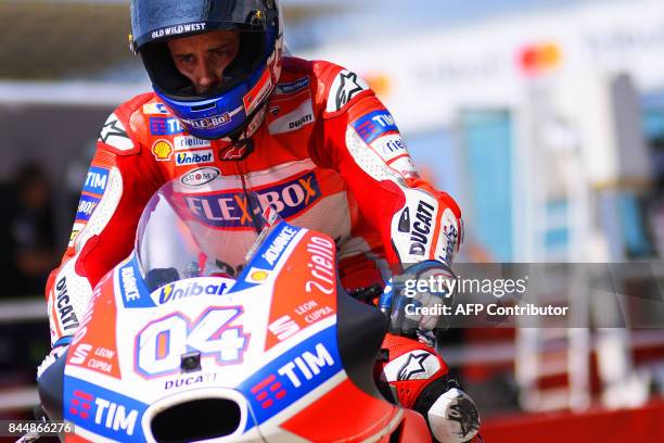 Ducati Team's Italian rider Andrea Dovizioso rides his bike out of the pit during a free practice session for the San Marino Moto GP Grand Prix race...