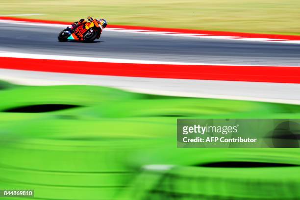 Red Bull KTM's British rider Bradley Smith rides his bike during a practice session for the San Marino Moto GP Grand Prix race at the Marco...
