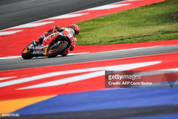 Repsol Honda spanish rider Marc Marquez rides his bike during a qualifying session for the San Marino Moto GP Grand Prix race at the Marco Simoncelli...