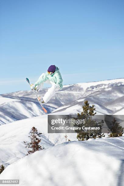 snowboarder flies off jump - avon colorado stock pictures, royalty-free photos & images