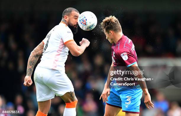 Blackpool's Kyle Vassell vies for possession with Scunthorpe United's Conor Townsend during the Sky Bet League One match between Scunthorpe United...