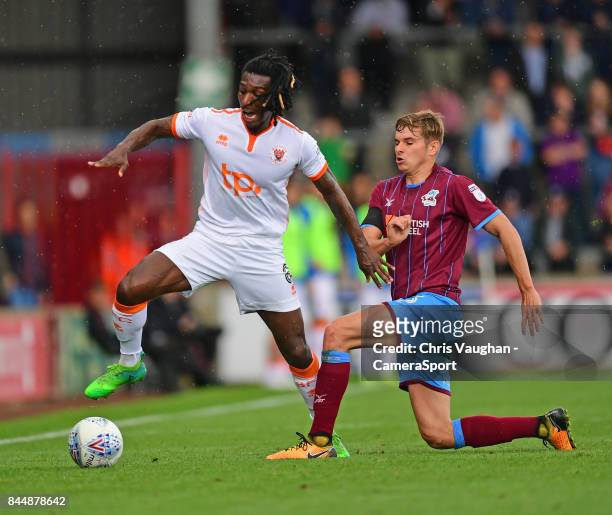 Blackpool's Sessi D'Almeida is fouled by Scunthorpe United's Conor Townsend during the Sky Bet League One match between Scunthorpe United and...