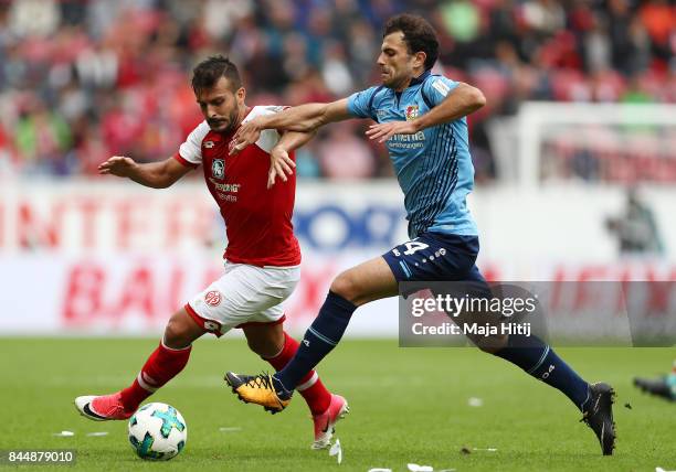 Giulio Donati of Mainz fights for the ball with Admir Mehmedi of Bayer Leverkusen during the Bundesliga match between 1. FSV Mainz 05 and Bayer 04...