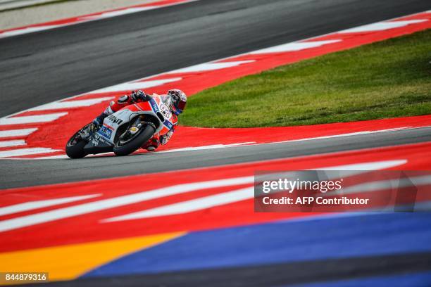 Ducati team italian rider Andrea Dovizioso rides his bike during a qualifying session for the San Marino Moto GP Grand Prix race at the Marco...