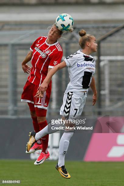 Verena Faisst of Bayern Muenchen and Giulia Gwinn of SC Freiburg in action during the women Bundesliga match between Bayern Muenchen and SC Freiburg...