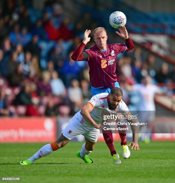 Blackpool's Kyle Vassell is fouled by Scunthorpe United's Neal Bishop during the Sky Bet League One match between Scunthorpe United and Blackpool at...