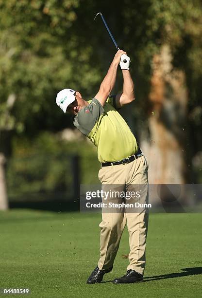 Brad Adamonis hits his second shot on the second hole at the Bermuda Dunes Country Club during the fourth round of the Bob Hope Chrysler Classic on...