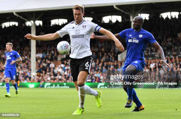 Fulham's Kevin McDonald battles for the ball with Cardiff City's Sol Bamba during the Sky Bet Championship match at Craven Cottage, London.