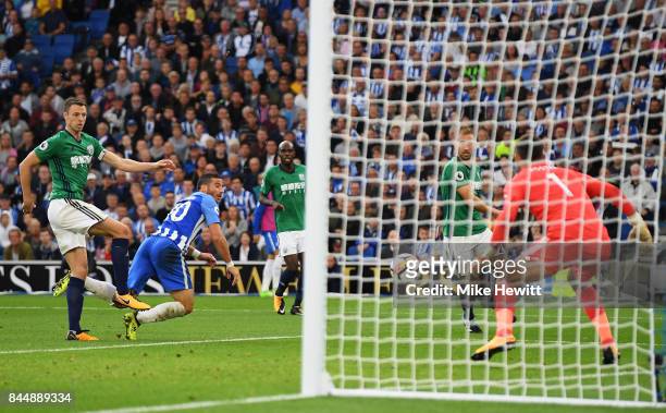 Tomer Hemed of Brighton and Hove Albion scores his sides third goal during the Premier League match between Brighton and Hove Albion and West...