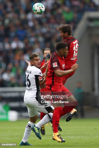 Raul Bobadilla of Moenchengladbach , Simon Falette of Frankfurt and David Abraham of Frankfurt fight for the ball during the Bundesliga match between...