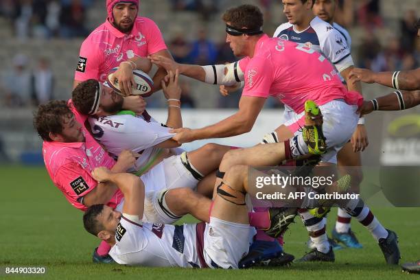 Bordeaux-Begles' French hooker Clement Maynadier is tackled during the French Top 14 rugby union match between Bordeaux-Begles and Stade Francais on...