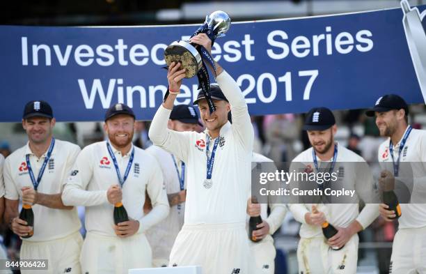 England captain Joe Root lifts the series trophy after winning the 3rd Investec Test match between England and the West Indies at Lord's Cricket...