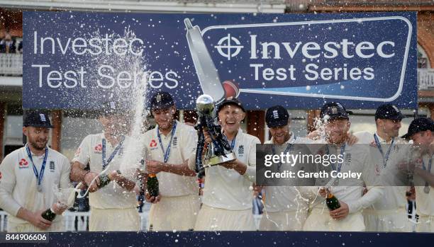 England captain Joe Root lifts the series trophy after winning the 3rd Investec Test match between England and the West Indies at Lord's Cricket...