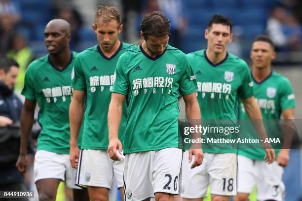 Dejected Grzegorz Krychowiak with his West Bromwich Albion team mates after the 3-1 defeat during the Premier League match between Brighton and Hove...