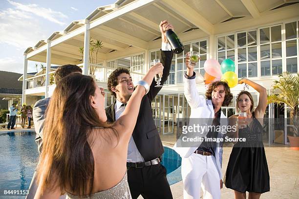 people having a pool party - human limb stock pictures, royalty-free photos & images