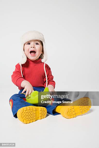 a boy holding a bowl of grapes - deerstalker hat stock pictures, royalty-free photos & images