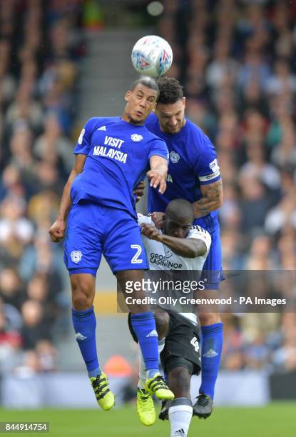 Fulham's Denis Odoi vies with Cardiff City's Lee Peltier during the Sky Bet Championship match at Craven Cottage, London.