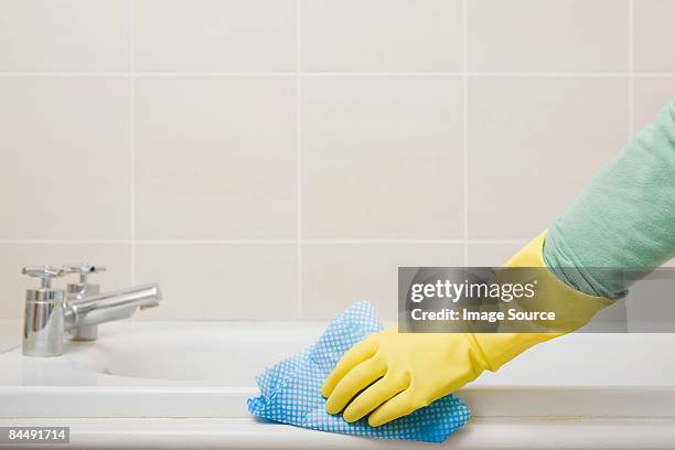 person cleaning bath - bathroom foto e immagini stock