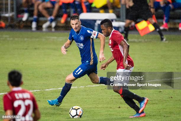 Awal Mahama of Hong Kong Pegasus dribbles Marko Perovic R&F F.C during the Premier League, week two match between Hong Kong Pegasus and R&F F.C at on...